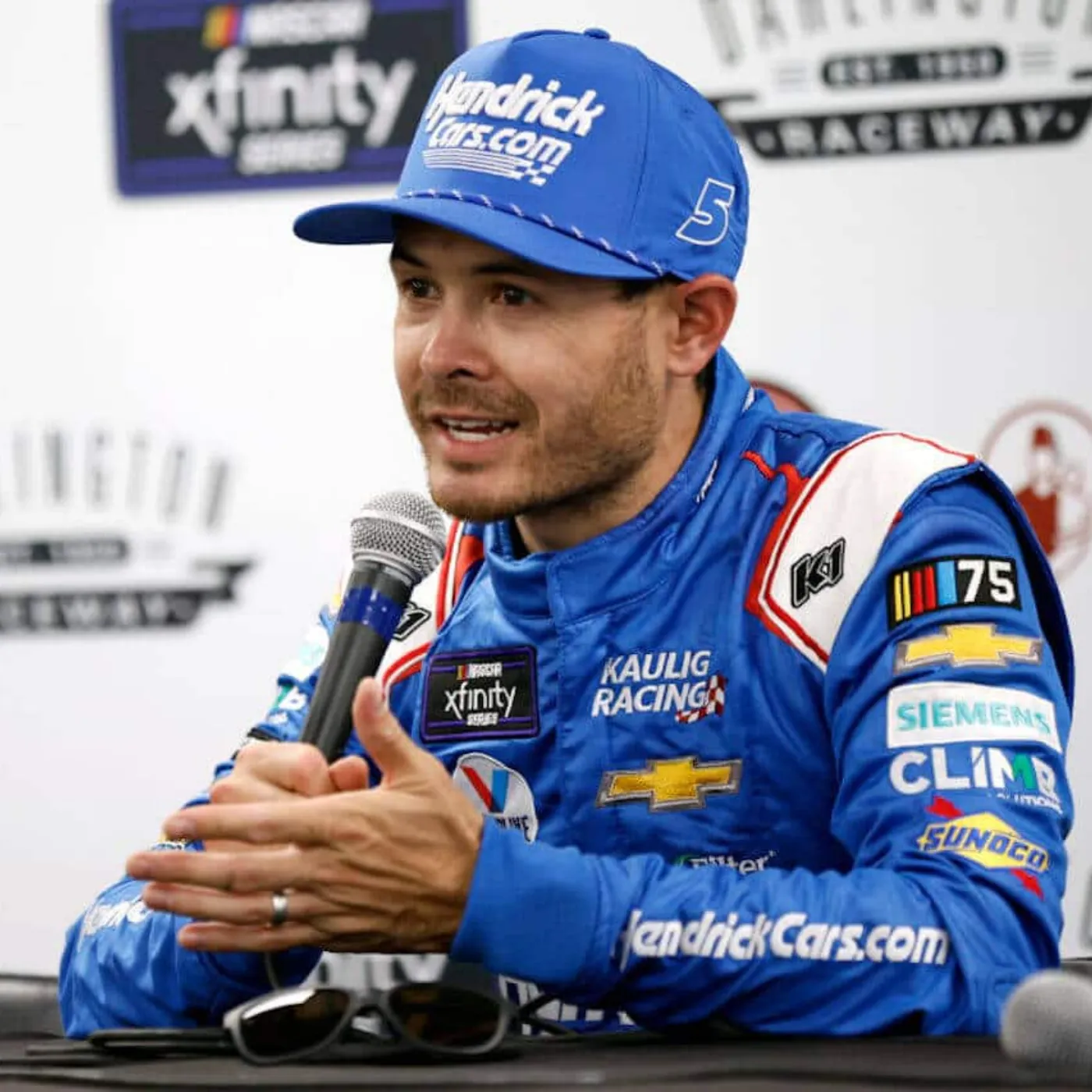 Cover Image for Sit Down, Barbie! Kyle Larson Teaches Bubba Wallace a Classic Lesson Live