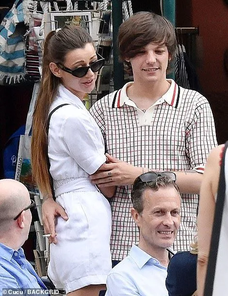 Louis Tomlinson is loved-up on holiday with girlfriend Eleanor Calder