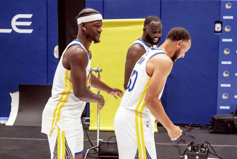 Stephen Curry (30), Draymond Green (23) and Jimmy Butler (10) laugh while getting into a pose for a portrait during Warriors media day at Chase Center in San Francisco,, on Monday, Sept. 29, 2025. (Carlos Avila Gonzalez/S.F. Chronicle)