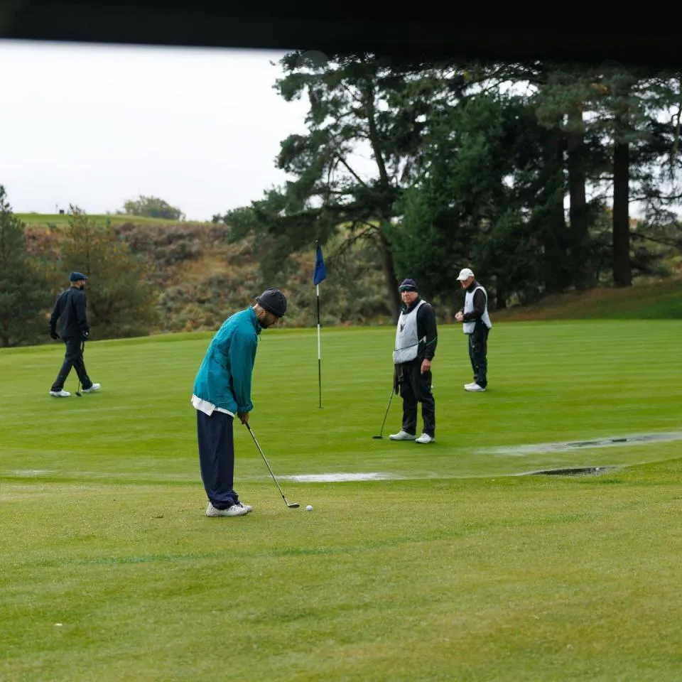 Justin Bieber playing golf at a luxury hotel.