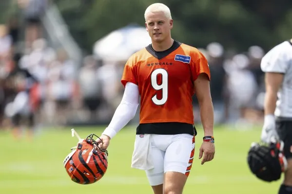 With hair newly cut and dyed, Bengals QB Joe Burrow says his wrist feels  good as training camp opens | AP News